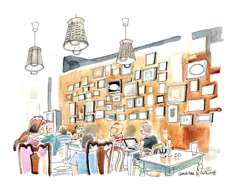 Cartoon illustration of a cosy busy cafe with pictures on a wall.